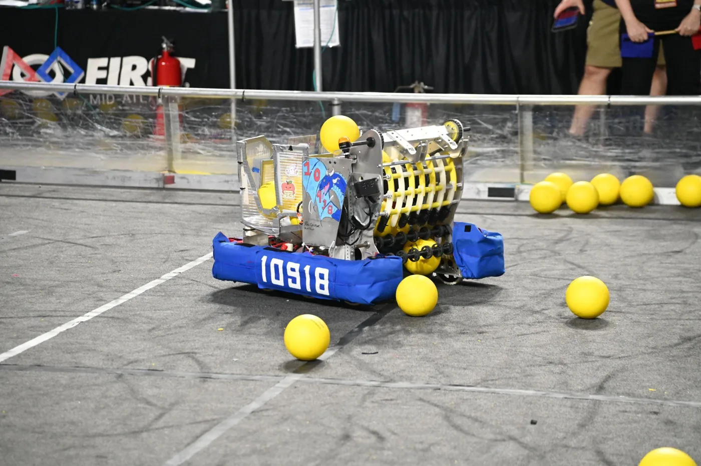 Angry Dragon, robot 10918 with blue bumpers, competing on the REBUILT field