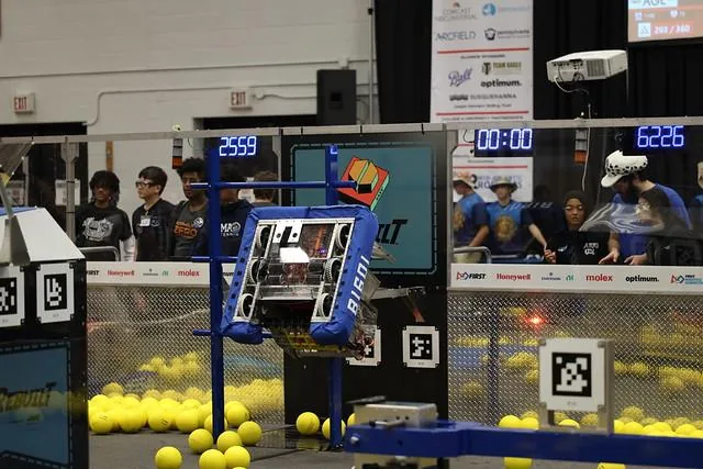 Angry Dragon suspended from the climbing structure during a match